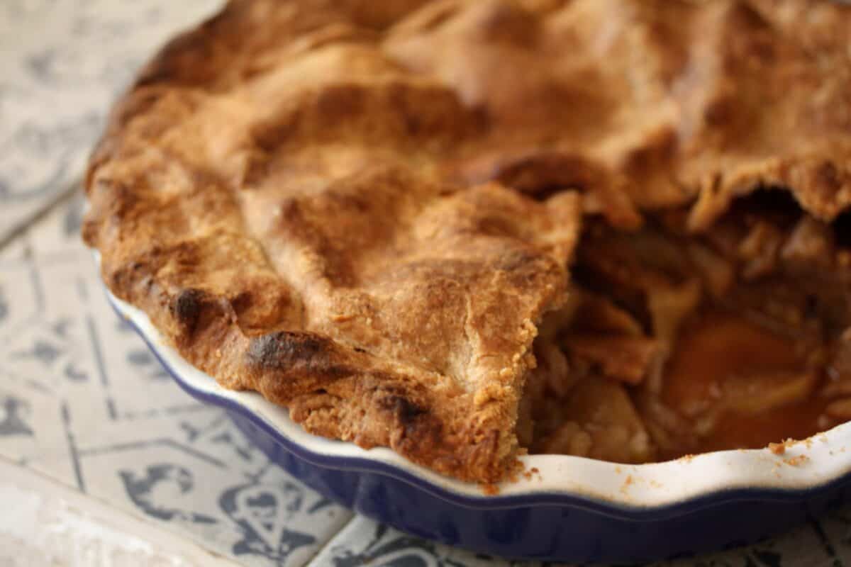 Gravenstein apple pie in a pie plate.