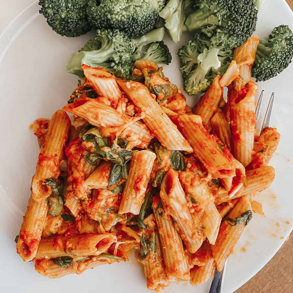 a portion of gluten free pasta bake with broccoli on a plate