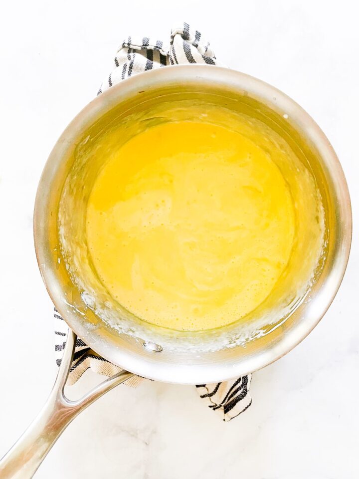 The fluffiest gluten free souffle with spinach and parmesan cheese is easily made gluten-free by using sweet white rice flour. Egg yolks are added to the roux.