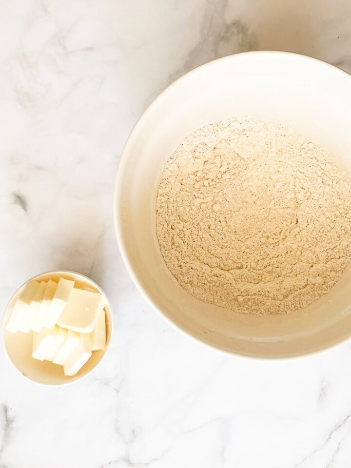Delicious Gravenstein Apple Pie makes the most of the apple's short season. Make this pie when Gravs are in season - you won't regret it! Butter is next to the flour mix for oat flour pie dough.