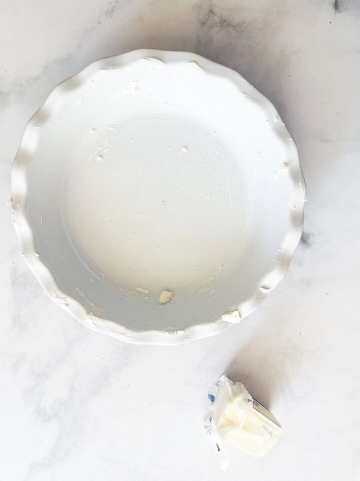 Delicious Gravenstein Apple Pie makes the most of the apple's short season. Make this pie when Gravs are in season - you won't regret it! A pie pan is buttered.