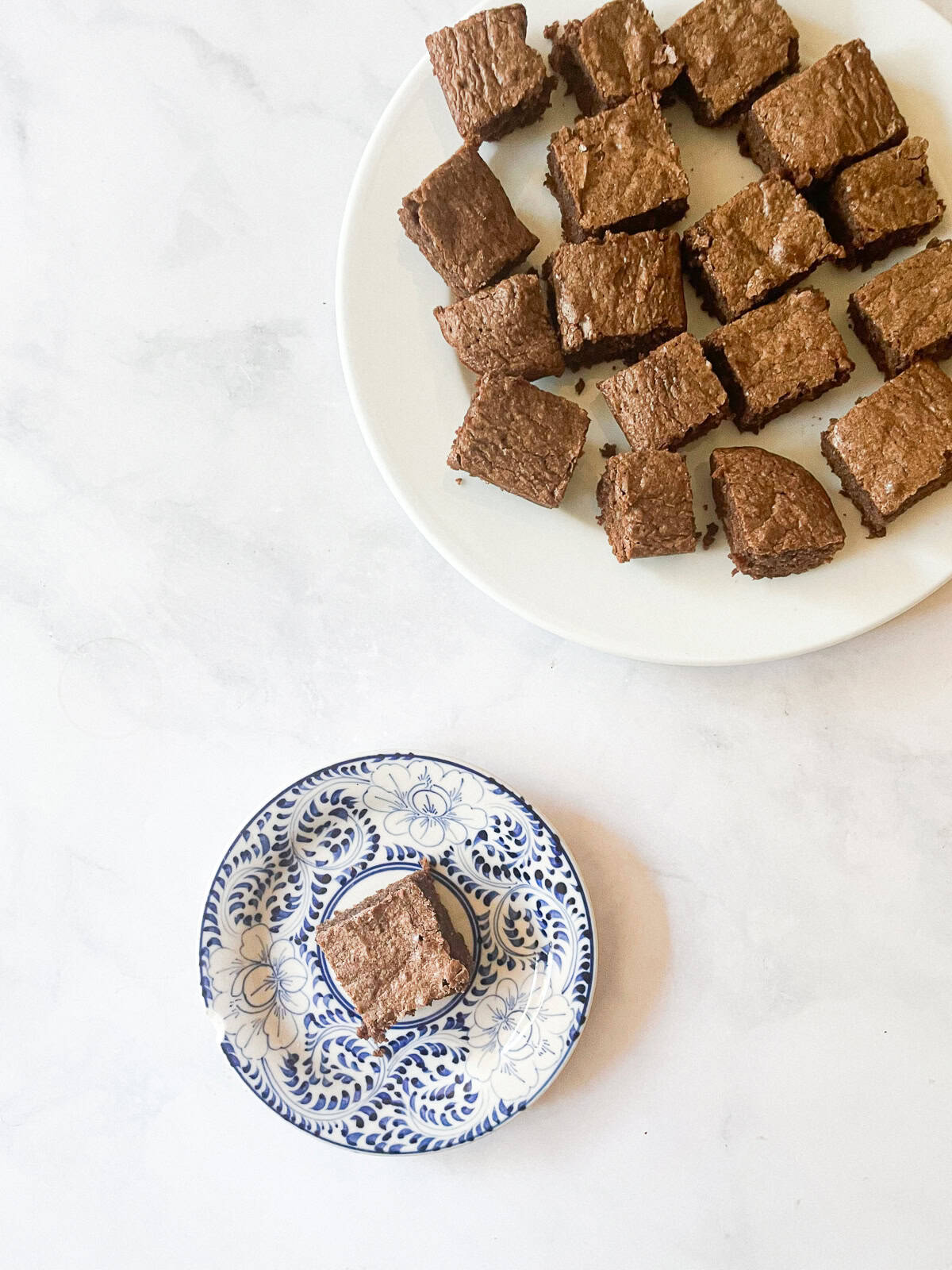 Rich whole wheat brownies are just like your favorite brownie recipe but made with whole wheat flour and melted chocolate. Whole wheat brownies on plates.