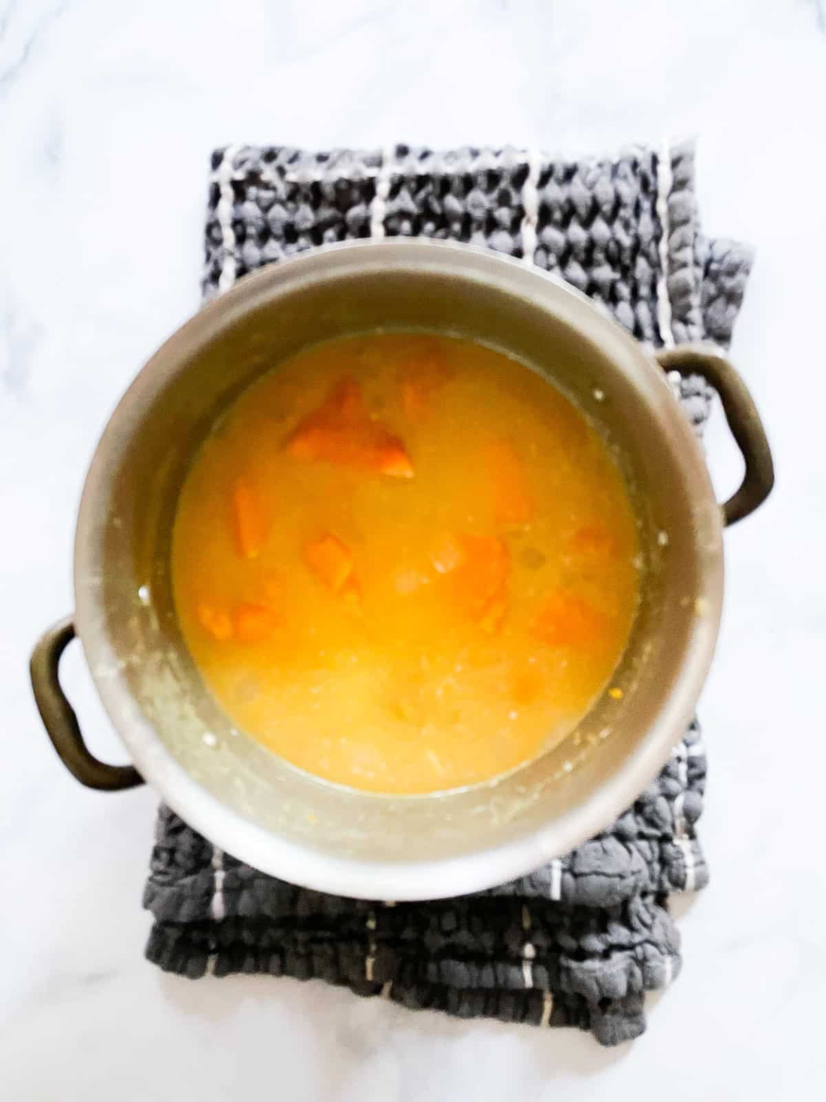 This gluten free butternut squash soup recipe elevates a classic with coconut milk, fresh ginger, and soy sauce. Water is added to the soup.
