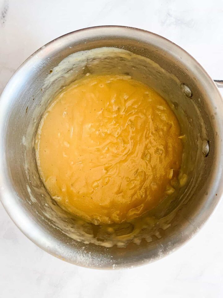 This easy vegan gravy recipe comes together in 15 minutes and is luxuriously smooth and flavorful. Perfect on the Thanksgiving table. A pot of vegan gravy.