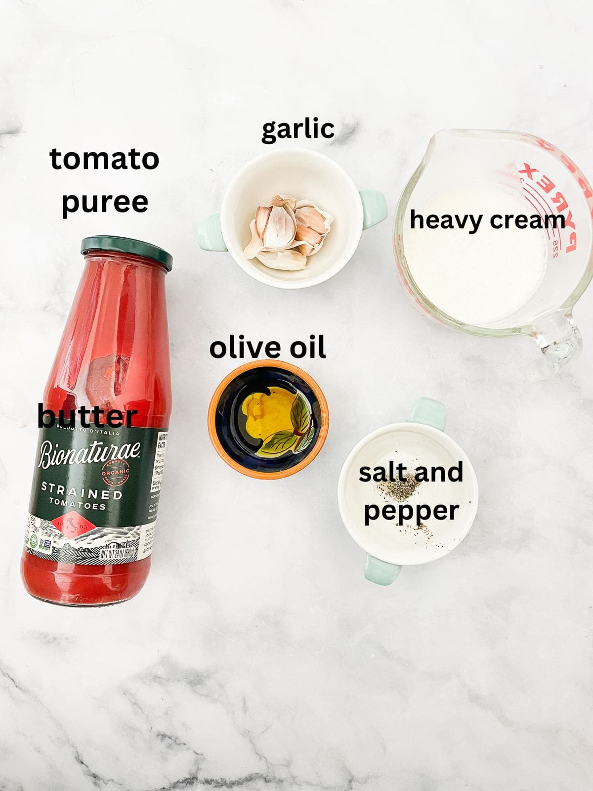 Rich and velvety smooth vegetarian cream of tomato soup is the definition of comfort food-perfect on its own or paired with grilled cheese. Ingredients for vegetarian cream of tomato soup are text-labeled.