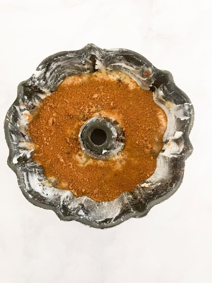 This luscious blueberry yogurt cake is loaded with juicy berries and a sweet cinnamon swirl. Gluten-free option included! A layer of cinnamon sugar added to cake batter.