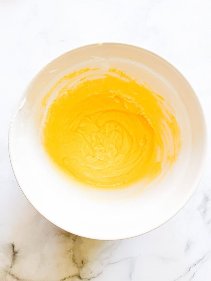 This classic French-inspired lemon yogurt cake is a reliable one-bowl recipe that always turns out perfectly. Yogurt cake batter in a bowl.