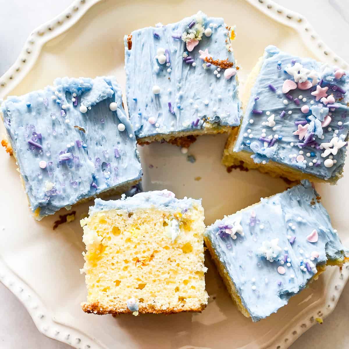 A unicorn bar turned on its side on a plate with more bars.