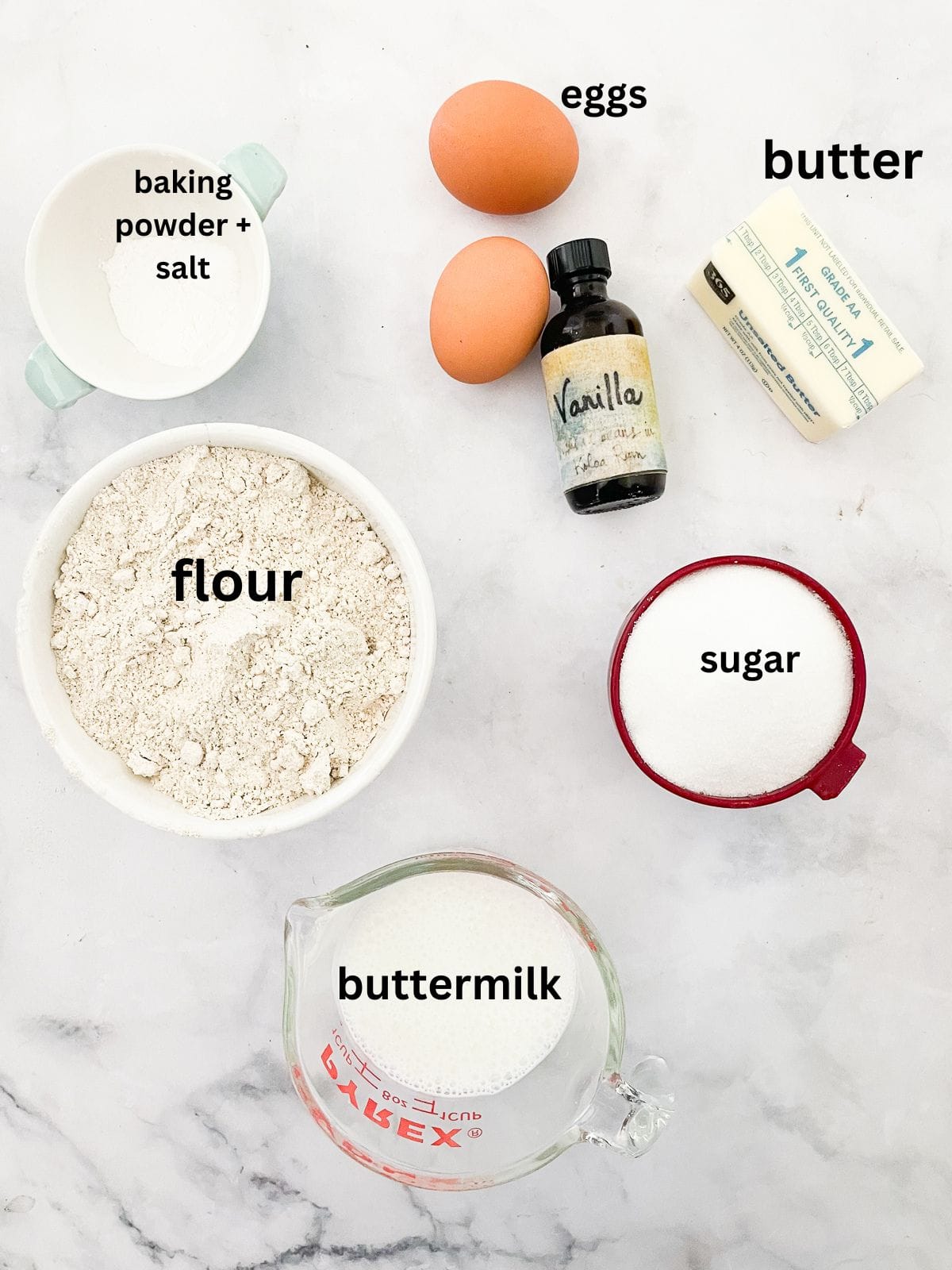 This beautifully simple and versatile buttermilk cake goes well with all sorts of frostings and can be used to make layer cakes and cupcakes. Ingredients for buttermilk cake are text labeled.