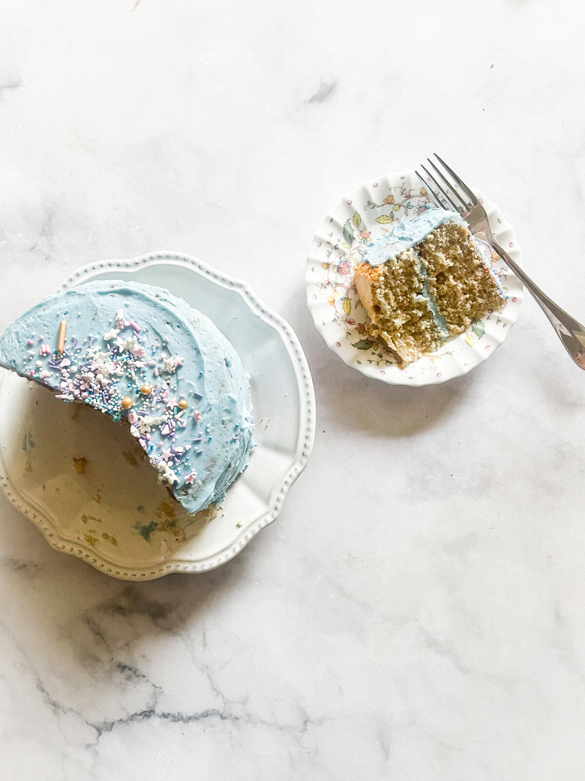 This beautifully simple and versatile buttermilk cake goes well with all sorts of frostings and can be used to make layer cakes and cupcakes. A slice of buttermilk cake on a plate next to the whole cake.