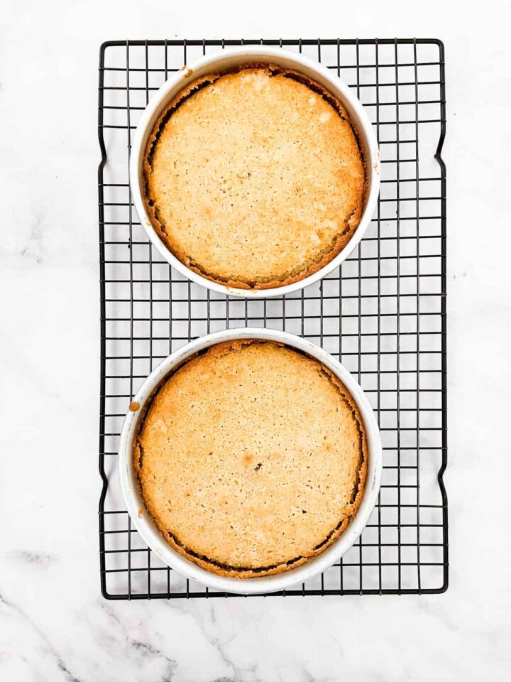 This beautifully simple and versatile buttermilk cake goes well with all sorts of frostings and can be used to make layer cakes and cupcakes. A buttermilk cake cools in the cake pans.