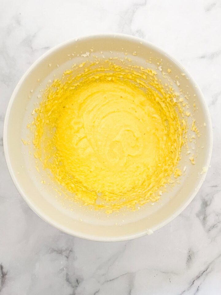 This beautifully simple and versatile buttermilk cake goes well with all sorts of frostings and can be used to make layer cakes and cupcakes. Eggs are added to butter and sugar.