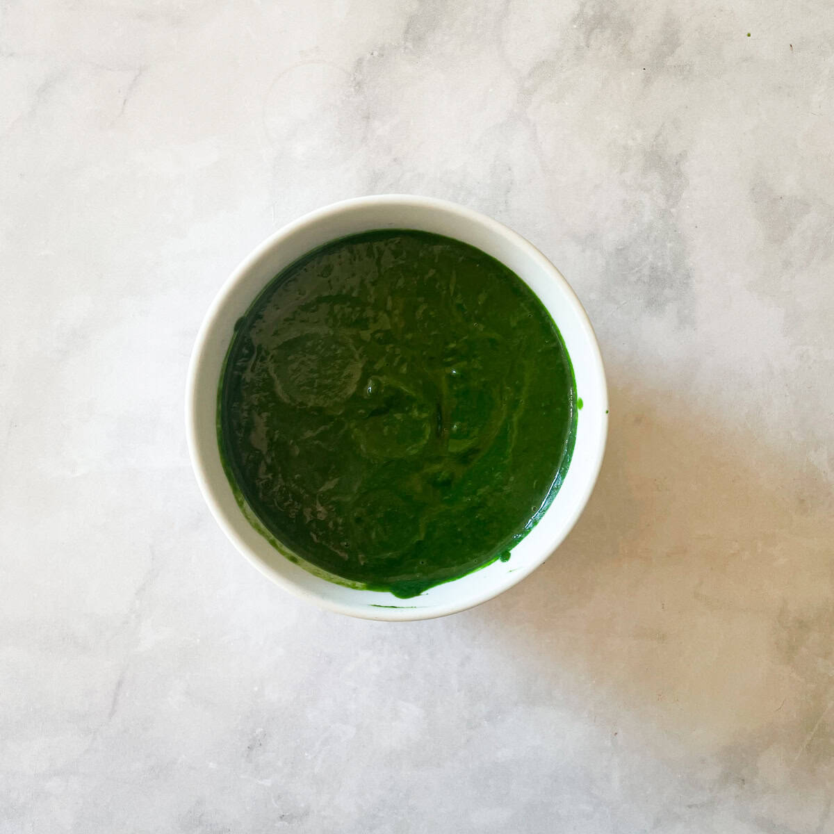 A bowl of kale pasta sauce.