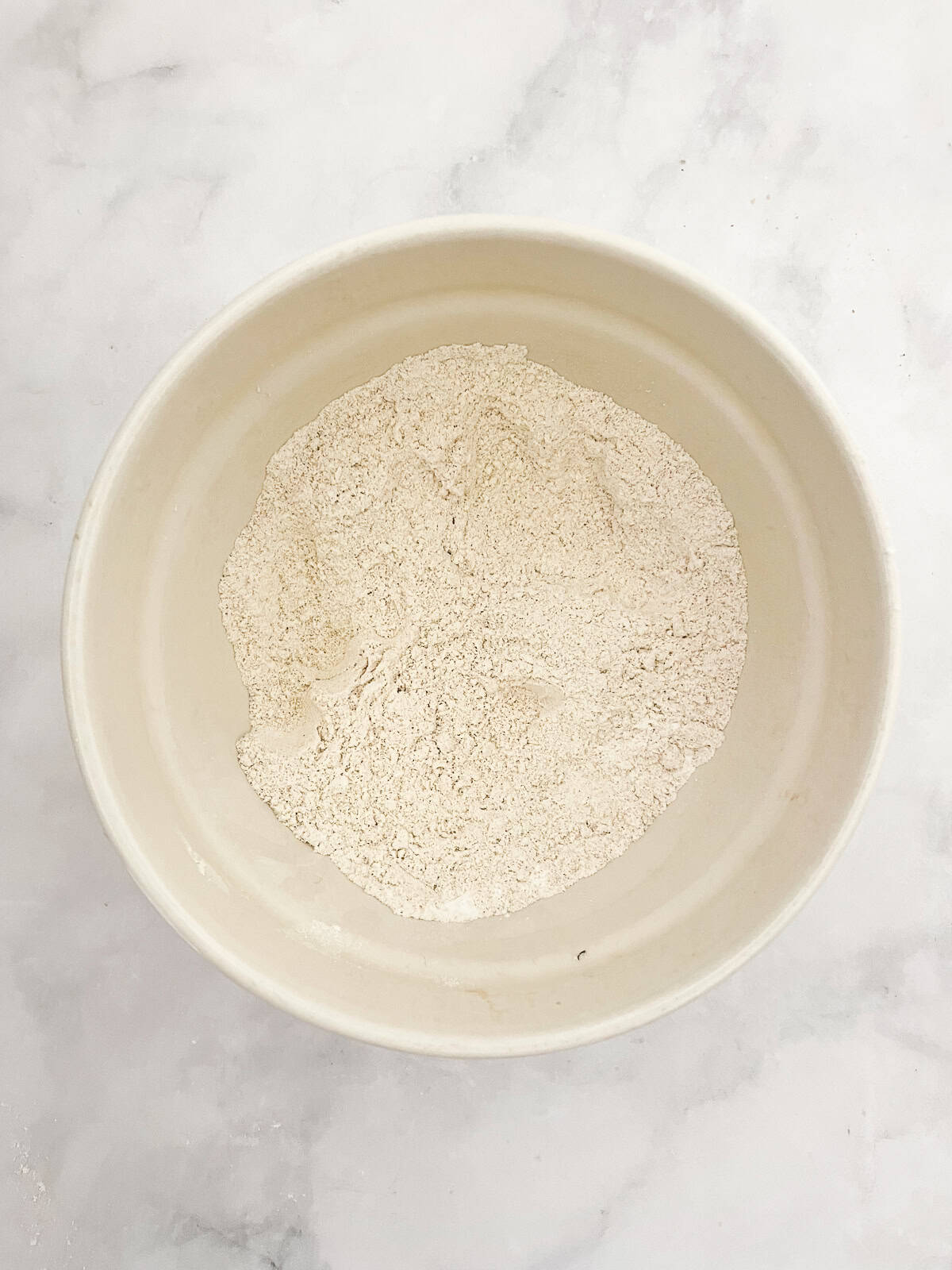 This gorgeous rhubarb upside-down cake drapes buttery rhubarb over a vanilla-scented cake for a beautiful, summery treat. Dry mix for upside-down rhubarb cake in a bowl.