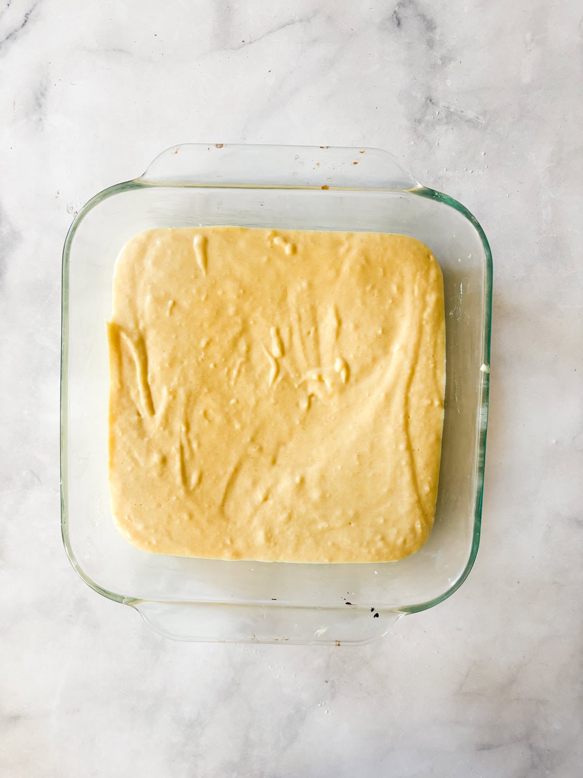 A delicious, lightly sweet homemade cornbread recipe that's made in 1 bowl. Perfect with your favorite soup, stew or chili. Cornbread batter is added to a pan.